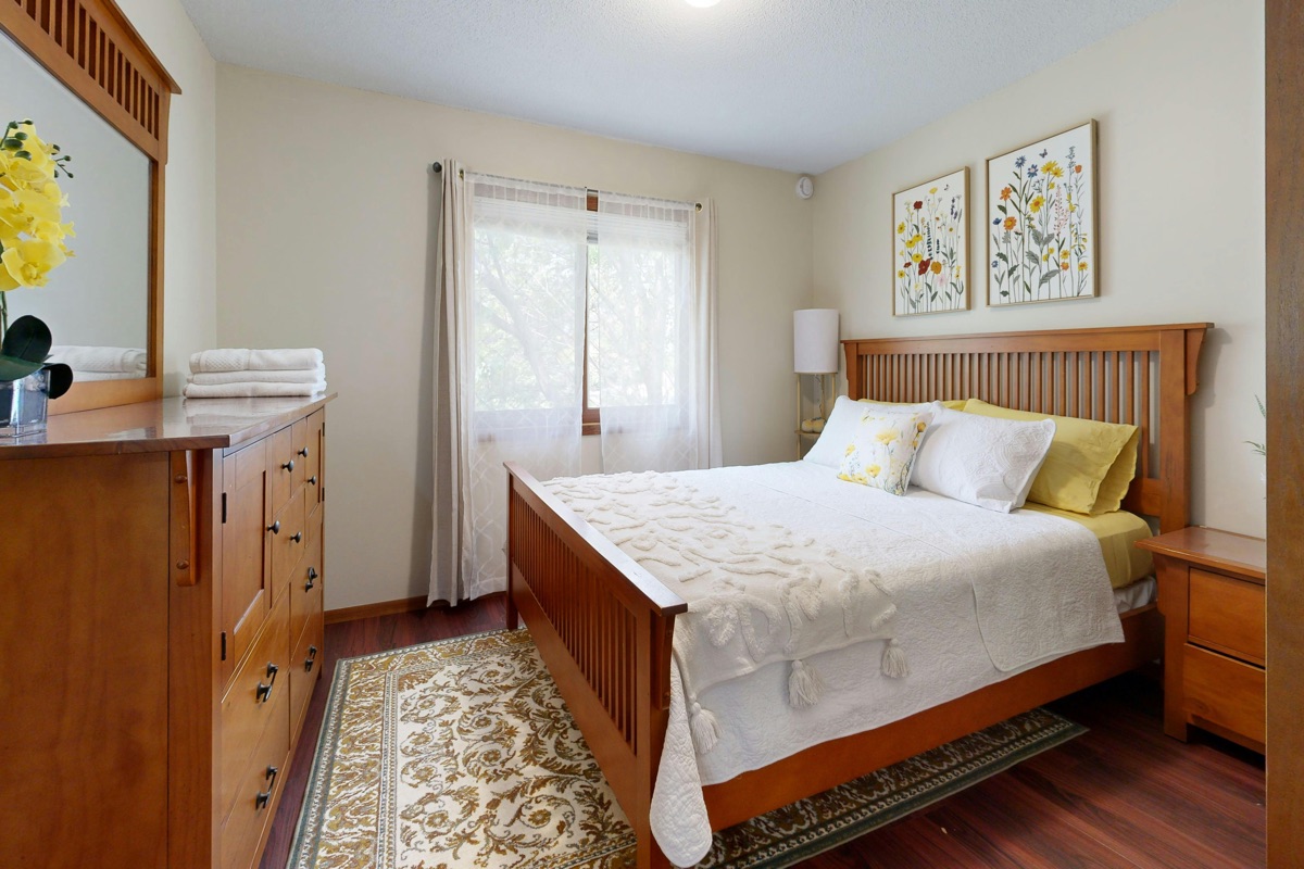 A clean, elegantly staged guest bedroom